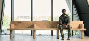 andu masebo sits on his bench at v&a east museum